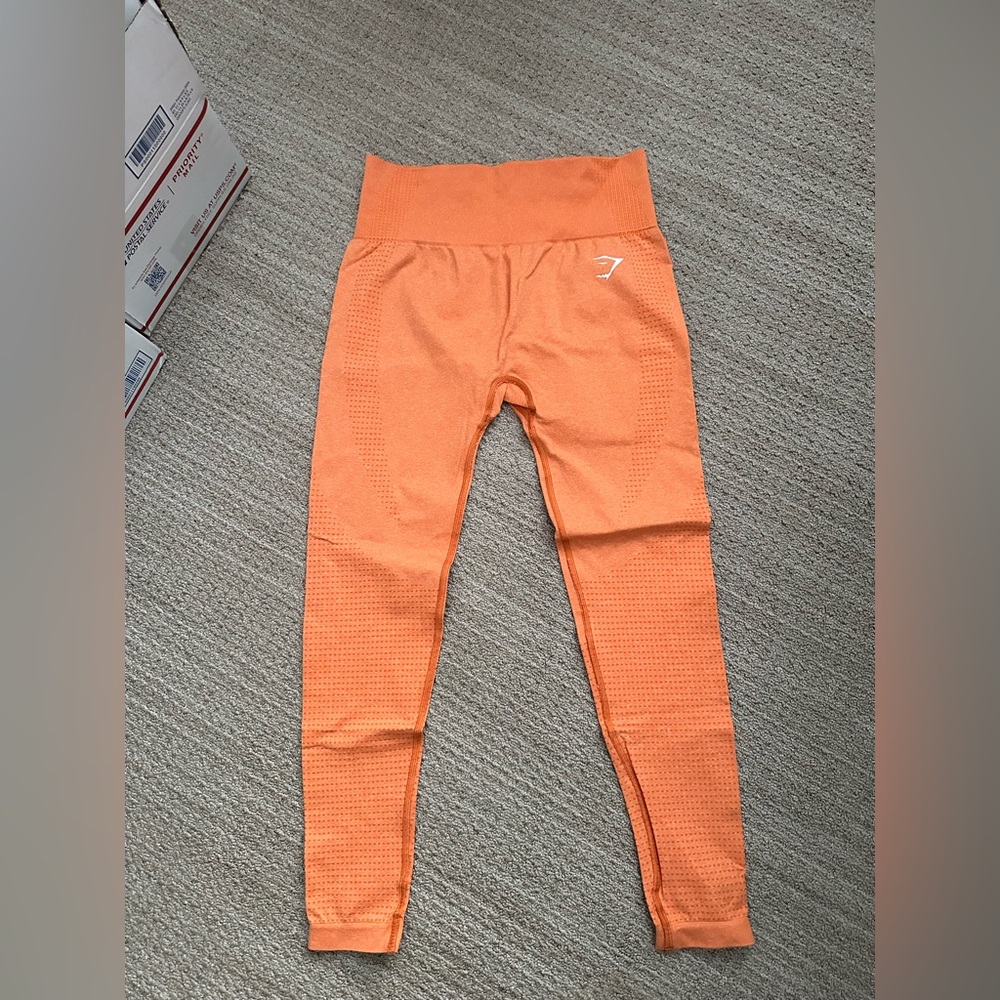 #239 Women's Gymshark Leggings in Orange in Size Medium.